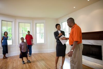 Couple with agent getting keys